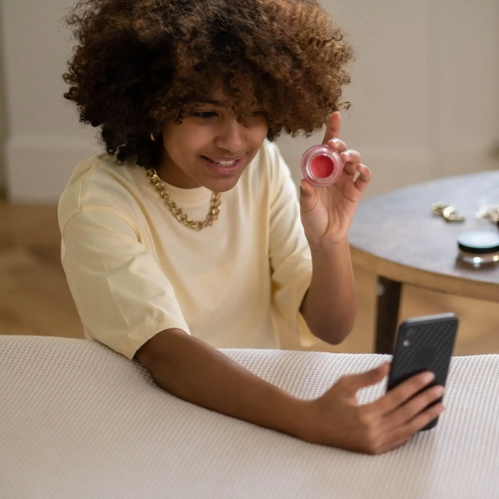 A beauty seller with her products and phone